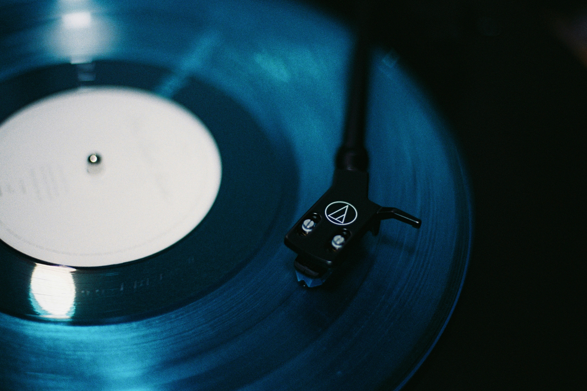 Vinyl record with stylus — Word Is Bond install reference